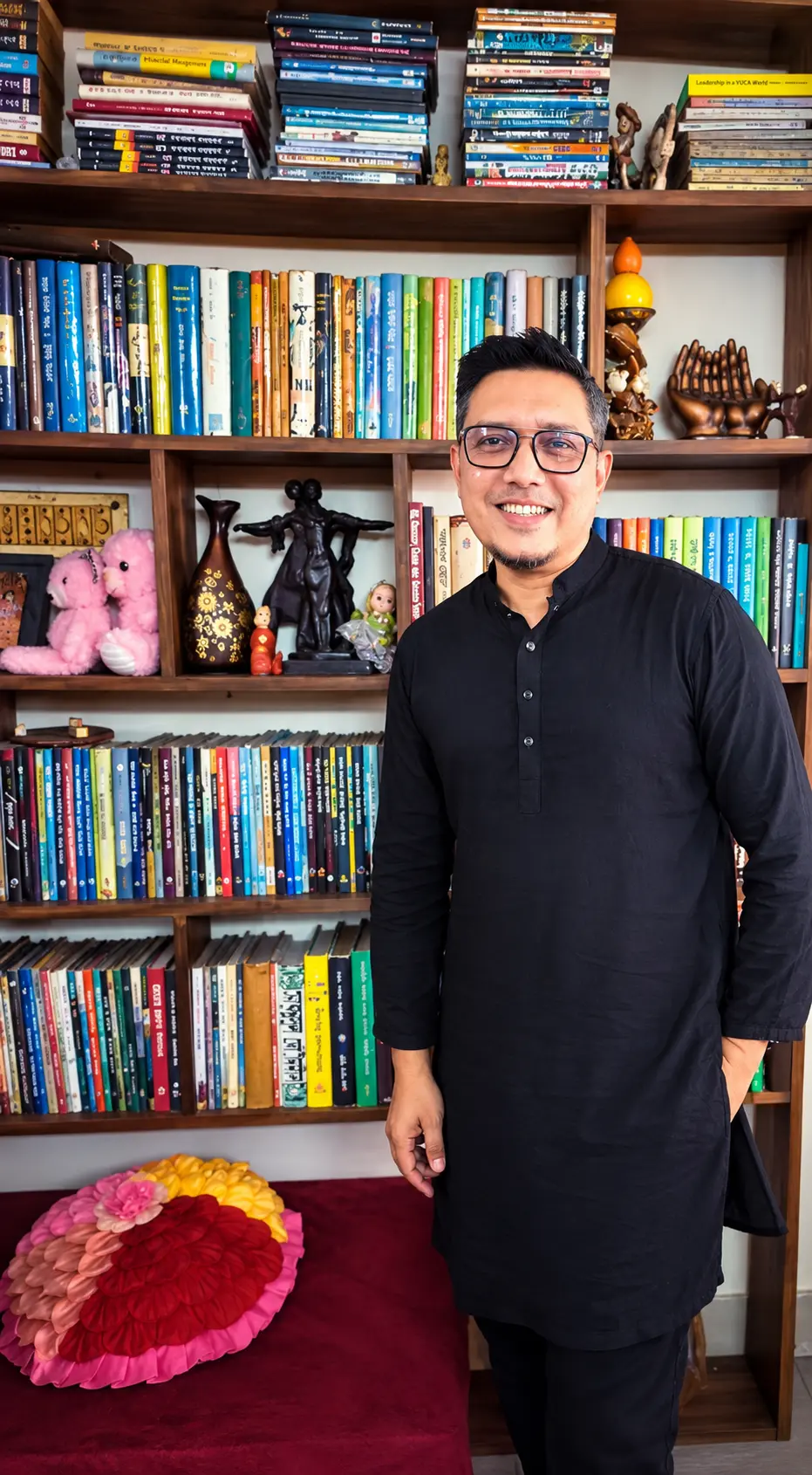Emon Anam, founder of Whimsy Read, among his bookshelves